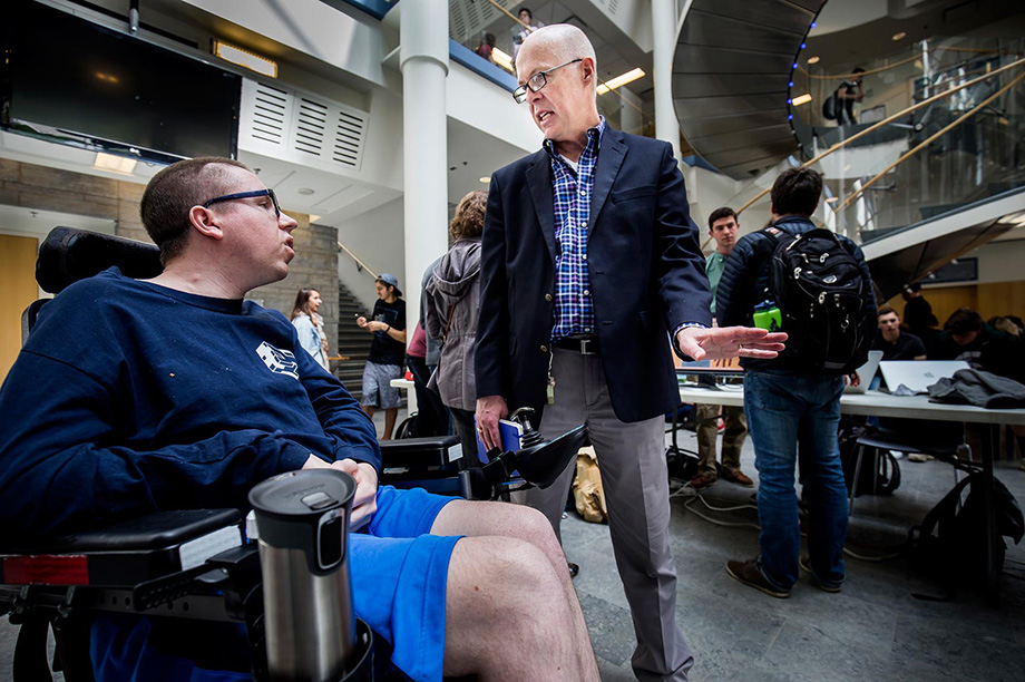 David Chesney (right) talks with Brad Ebenhoeh, for whom students in Chesney's senior-level engineering class developed assistive technology. (Photo by Joseph Xu, College of Engineering)