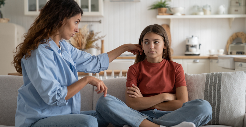 Mom speaking to her daughter to provide assurance. 