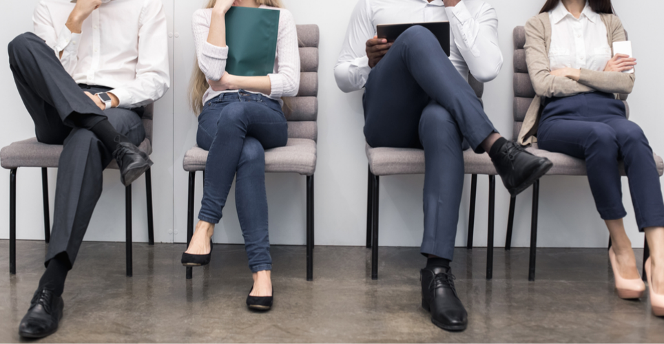 people sitting in chairs waiting