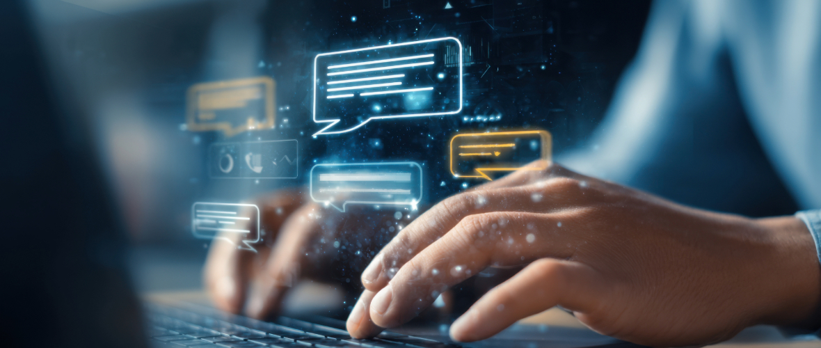 Hands typing on keyboard with digital chat icons above, representing AI-assisted communication.