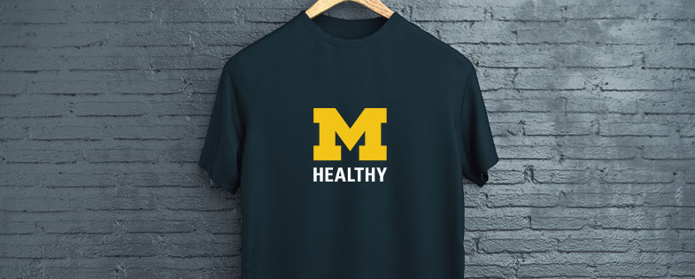 dark blue shirt on a hanger with MHealthy logo on it