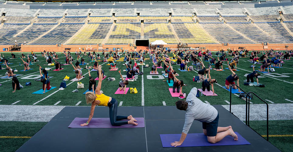 yoga class on Michigan Stadium's field.