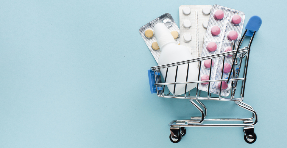 Mini shopping cart filled with medicine. 