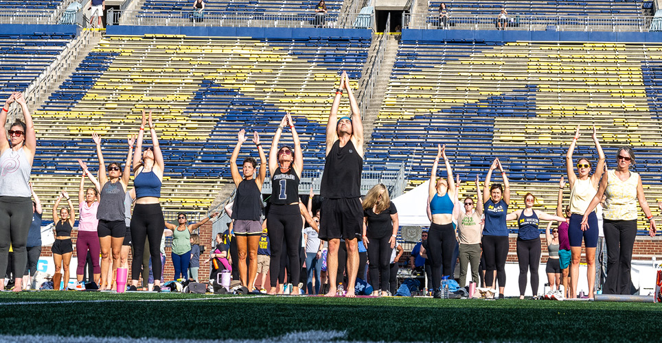 Yoga on the field at the Be Well in the Big House event in 2024.