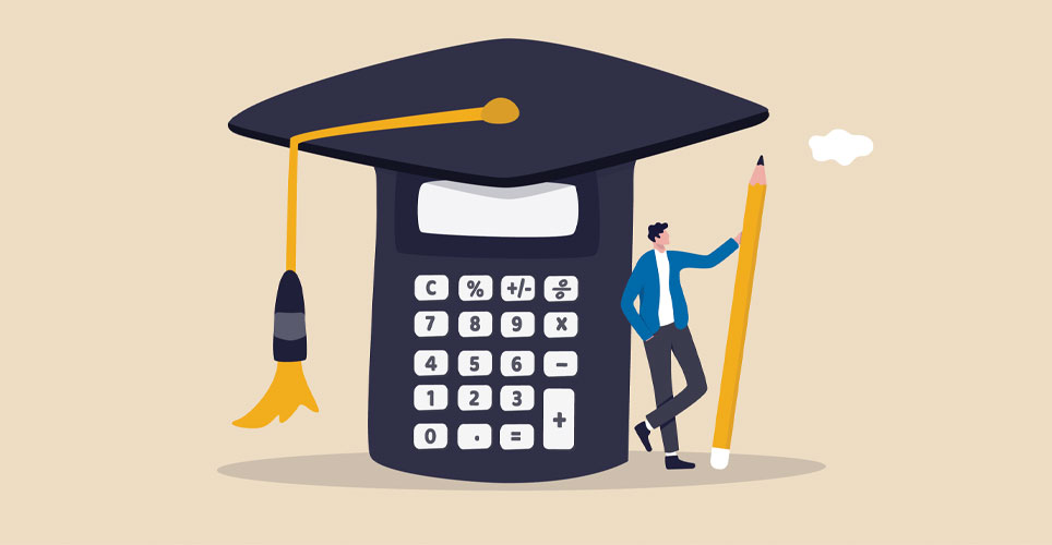 Close up of a large blue graduation cap with a calculator in it and a much smaller male student holding a pencil next to it