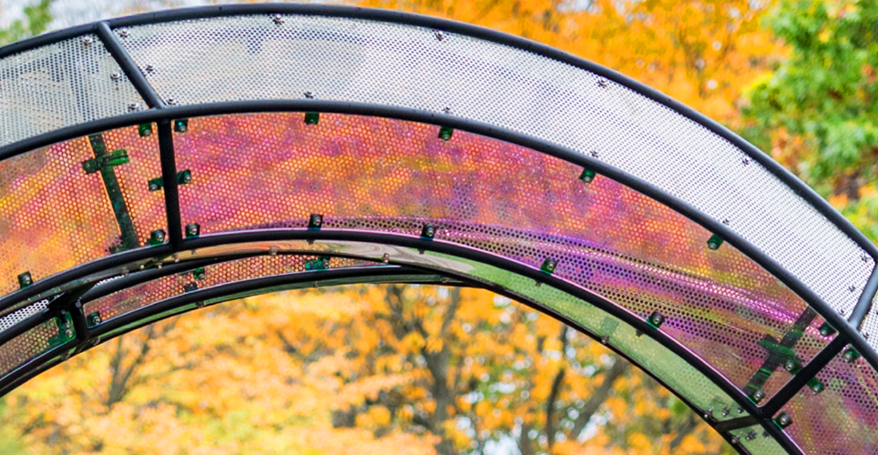 Section of sculpture Arriving Home, an iridescent circle honoring U-M Staff 