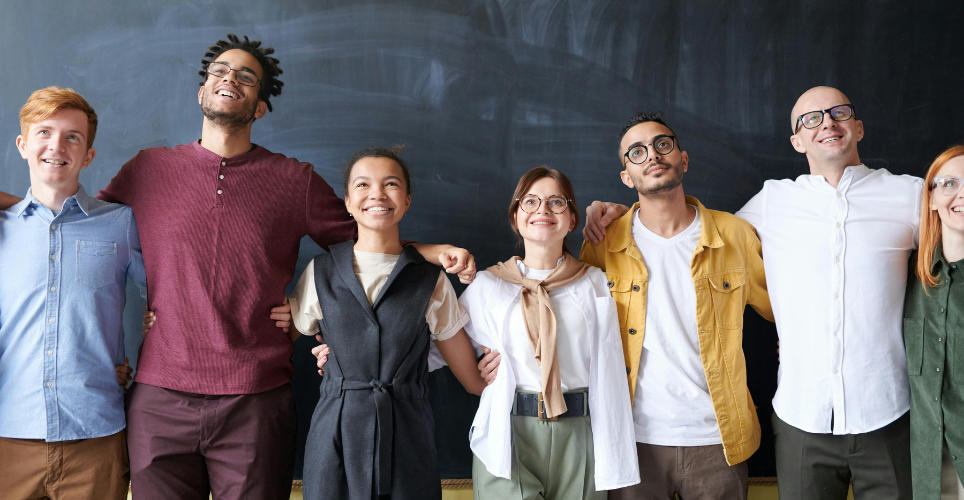 Group of coworkers hugging