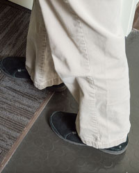 close up phots of a person standing with one foot in front of the other