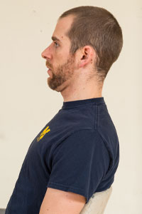 Photo of man with chin tucked in