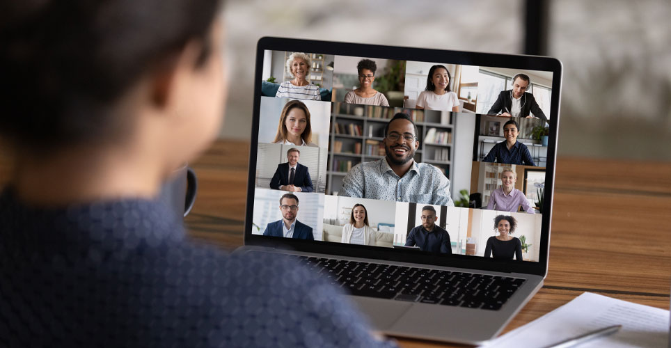 A person attending a virtual meeting on their laptop