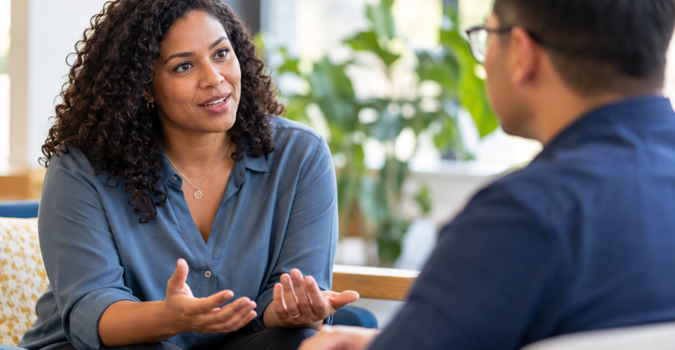 Two people having a difficult conversation at work