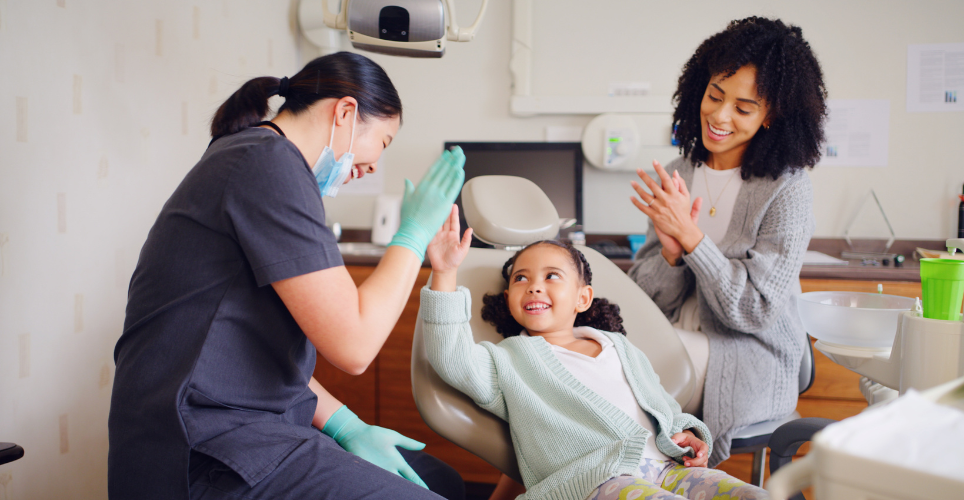 Child sitting in a dentist chair 