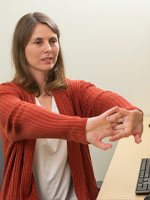 Woman sitting with arms outstretched