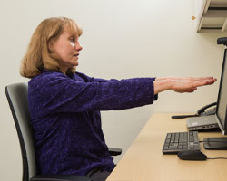 Photo of woman with arms stretched out in front of her