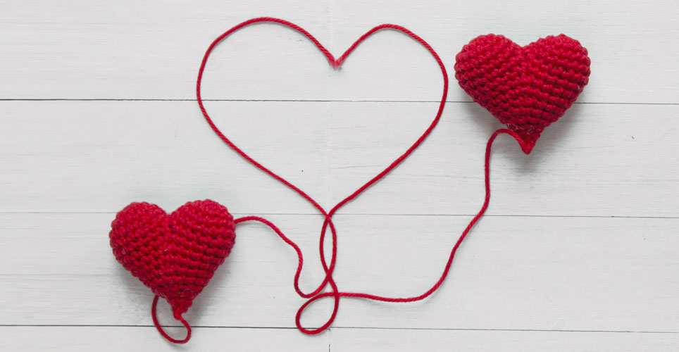 heart shapes knitted out of red yarn