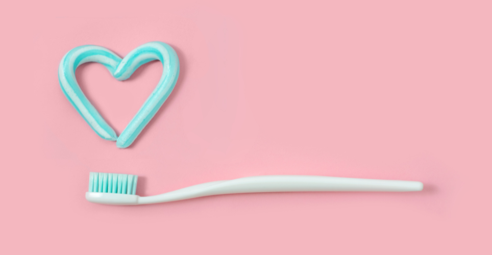 Toothbrush with toothpaste shaped like a heart