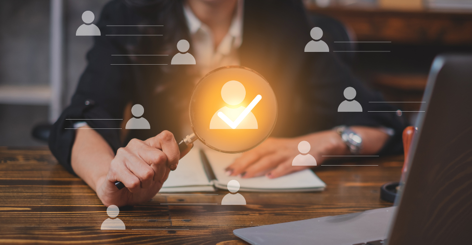 Hiring manager pointing an icon shaped like a person show they picked the right candidate 