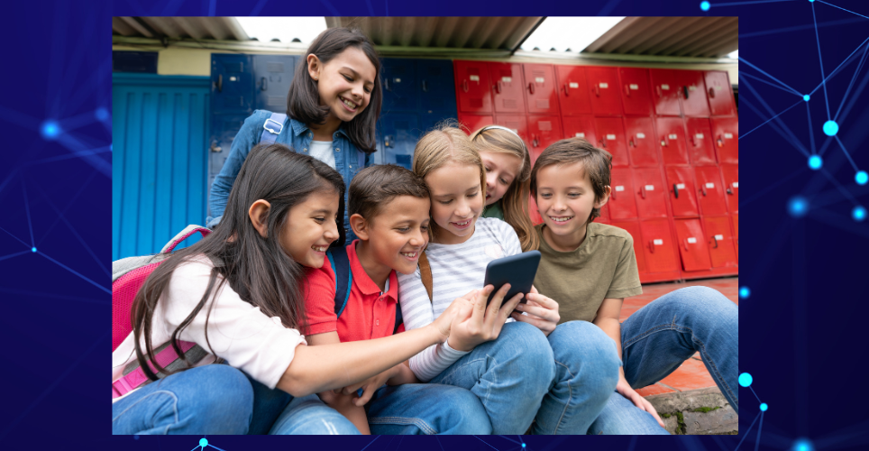 Kids looking at a mobile phone in a school hallway