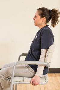 Photo of woman sitting facing left
