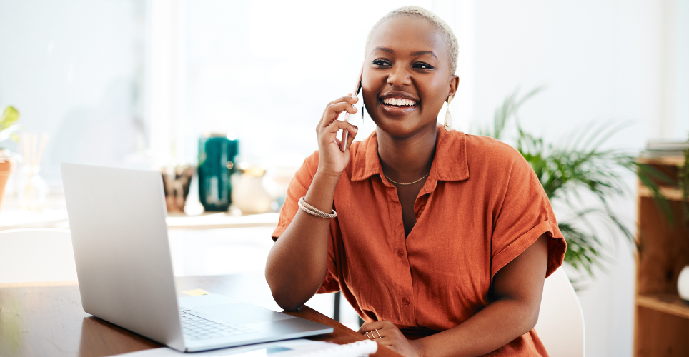Person sitting at their desk talking on the phone