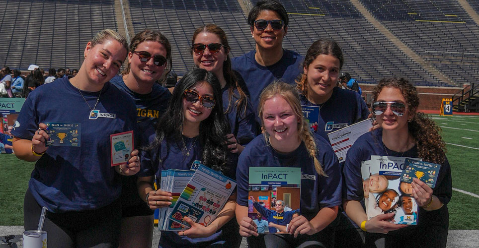 Dr. Rebecca Hasson and her students at Michigan Stadium.
