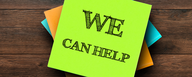 sticky note with "we can help" written on it