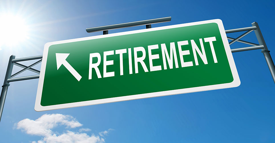 Green freeway sign with the word "retirement" and an arrow pointing to the sky