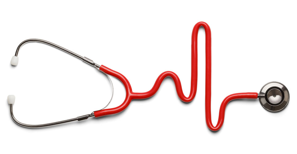 Close up of a stethoscope with red tubing that forms a heart rhythm