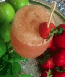Strawberry Citrus Fizz in a glass with a strawberry garnish