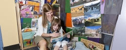 Child and teacher reading aloud