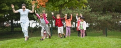 Children and teacher enjoying an outdoor game