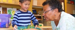 Teacher and student considering a seed-starting experiment