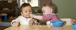 Infants enjoying snack time