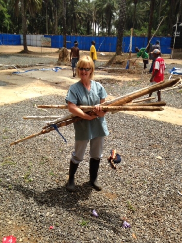Belinda Fish in Sierra Leone carrying wood