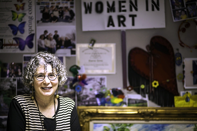 Elaine Sims in front of artwork 