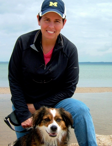 Elizabeth LaPorte with dog Sadie on Lake Michigan