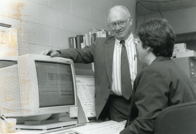 Joseph Owsley with Mary Jo Frank at a computer
