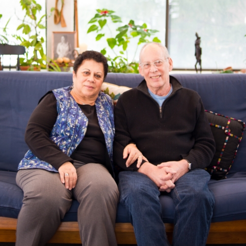 Huda and Jeff Karaman Rosen sitting on a couch