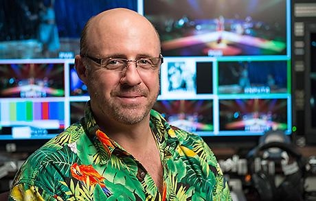 Jacques Mersereau standing in front of a digital screen