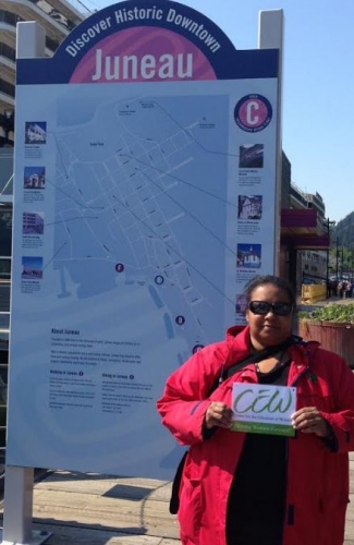 Janice Reuben standing in fron of Juneau, Alalska sign
