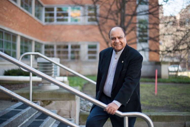 Jagdish Janveja standing in fron of building on the Ann Arbor campus