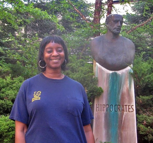 Linda Fleming standing in front of statue