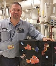 Mark Neumann in front of pipes