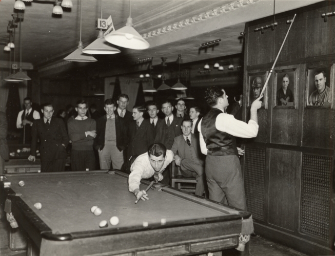 Men playing pool in the Michigan Union Billiards Room
