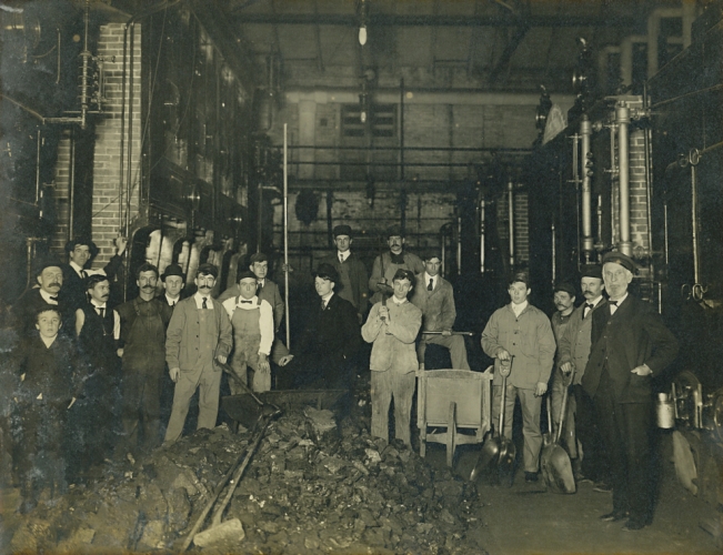 Power Plant workers 1917 with coal in foreground