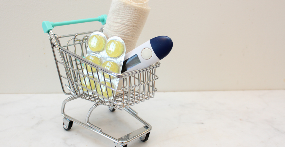 Mini shopping cart filled with medical items.