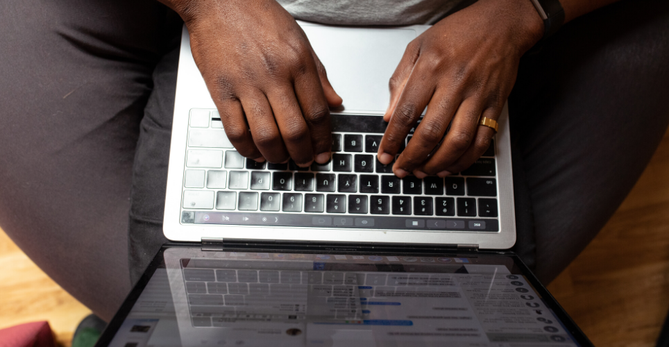 hands of man tying on laptop