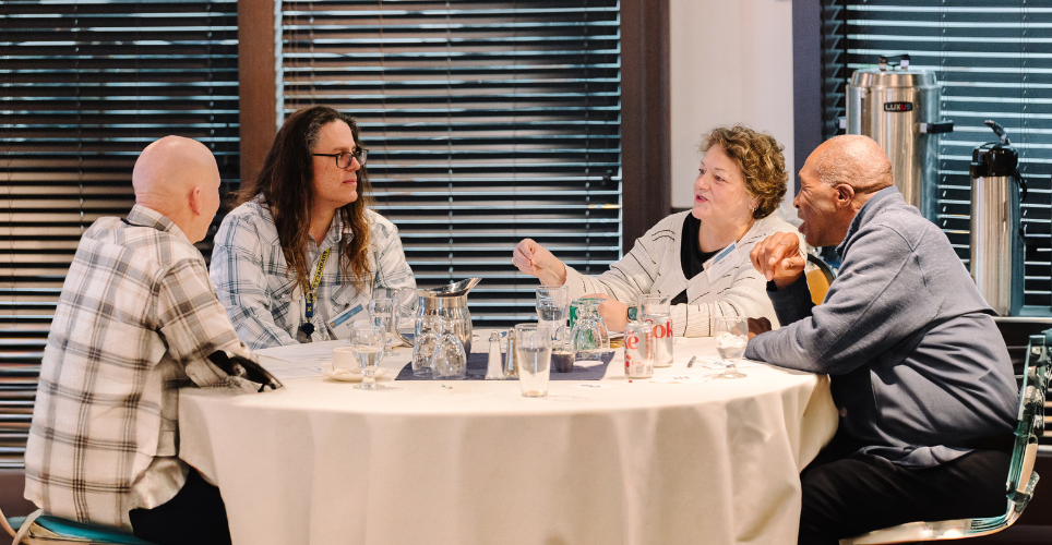 Group of people sitting at a table during the Leadership and Culture: Strategies to Prevent Workplace Issues workshop
